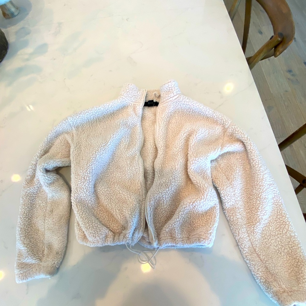 white fluffy jacket